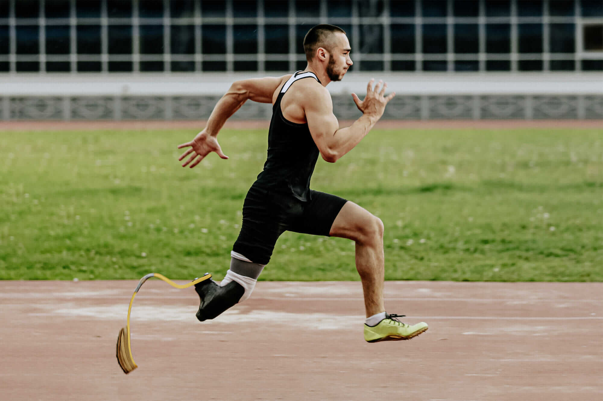 Male athlete with prosthetic leg running Mile High Psychology Athlete with prosthetic leg overcoming barrier with determination and strength