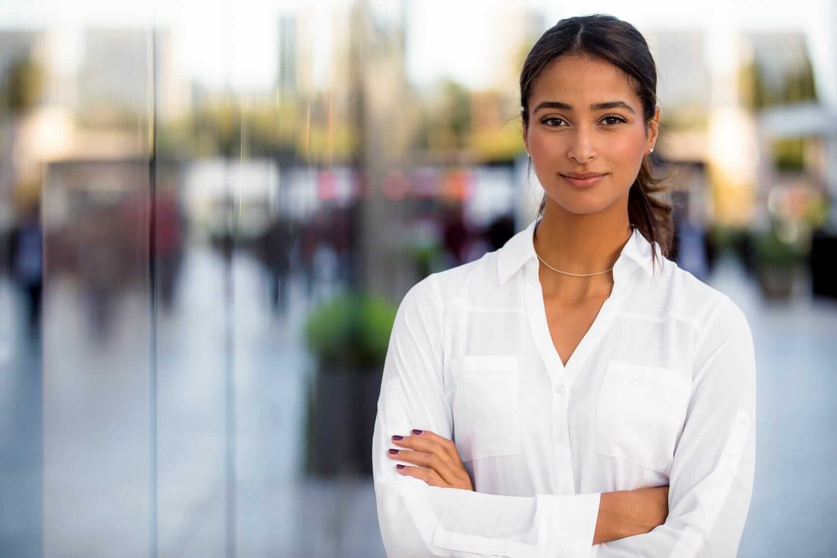 Confident woman on city street Mile High Psychology Example of renewed confidence and independence achieved through post-marital counseling