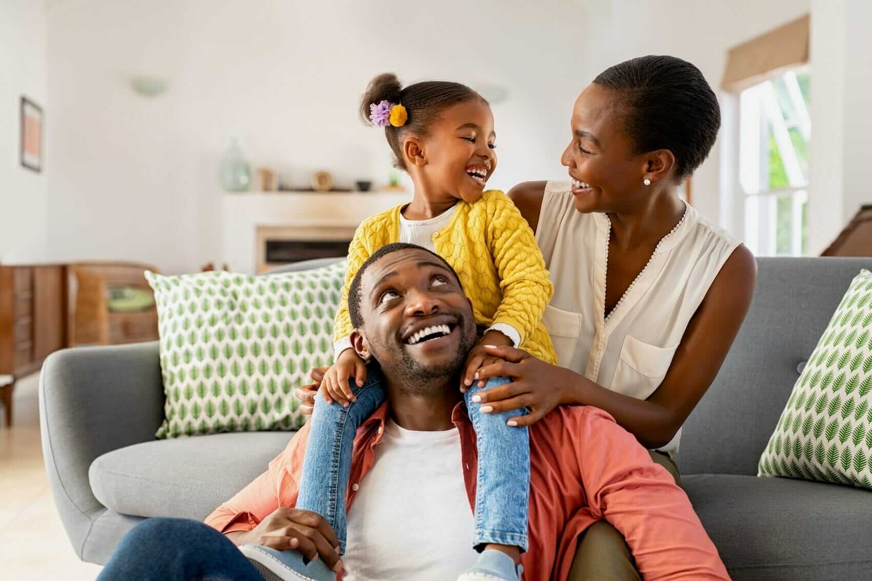 Parents with daughter at home Mile High Psychology Example of enjoying family time at home