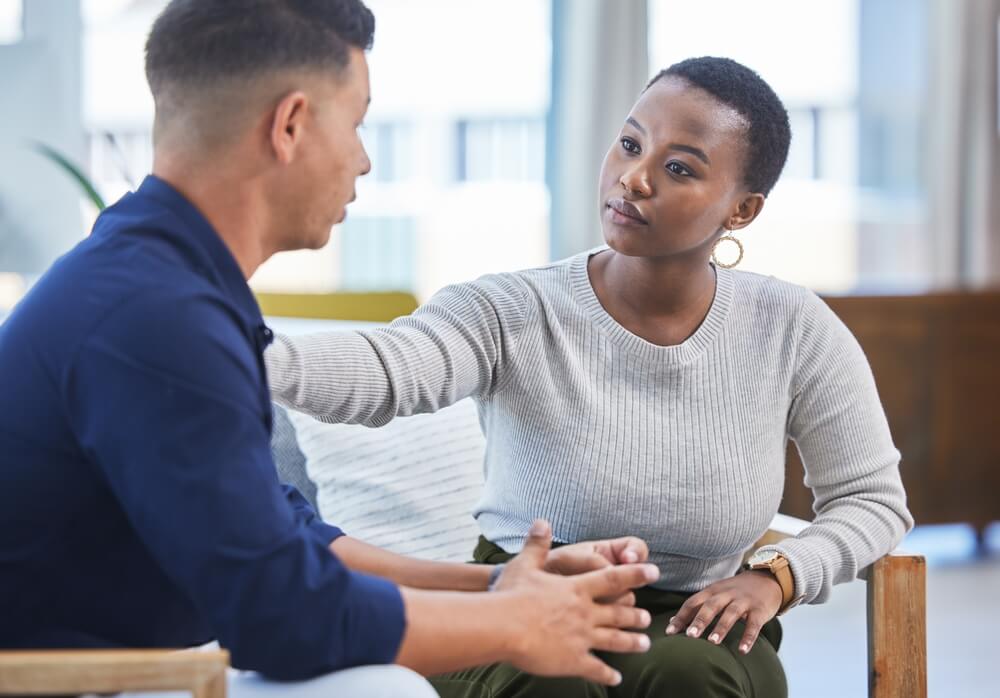 Case consultation Mile High Psychology Portraying a stress management consultation through a photograph of a therapist and client in an office setting.
